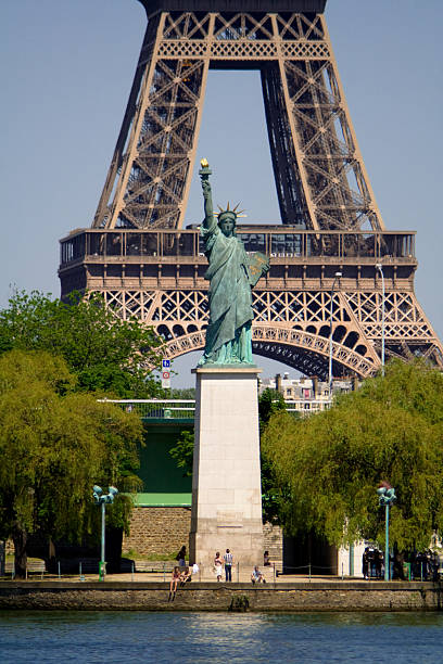 Liberty Statue in front of Eiffel Tower. Paris, France stock photo