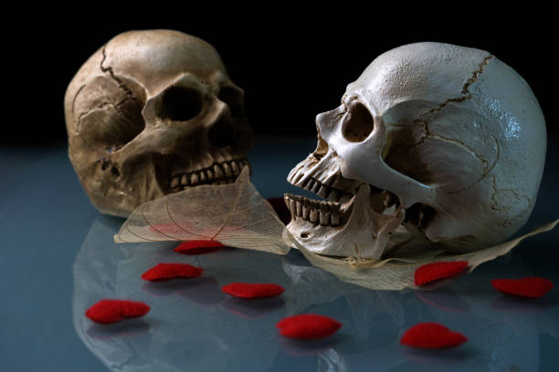 3D illustration of gnarled undead zombie hands grasping at screaming human skull