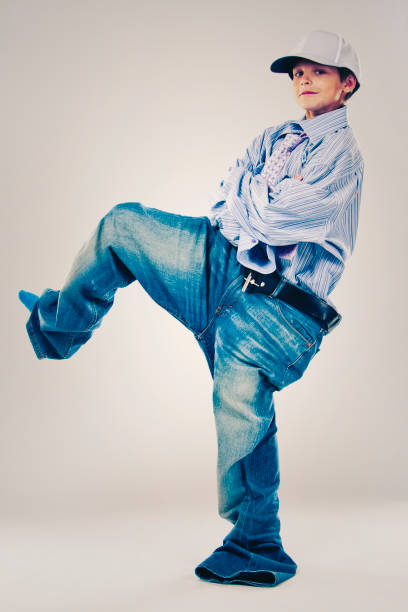istock funny boy wearing Dad's clothes 932553294