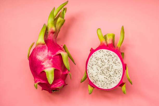 istock Creative layout made of pitahaya . Flat lay. Food concept. dragonfruit on pink background. 932556598