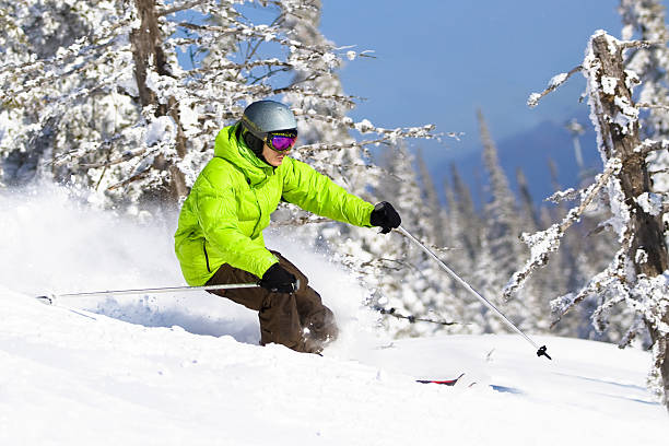 Young man skiing in forest. Freeride stock photo