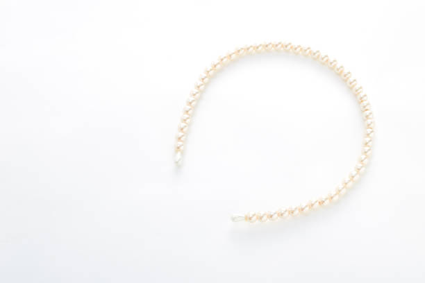 istock Head band with big white pearls isolated on white background 932560430