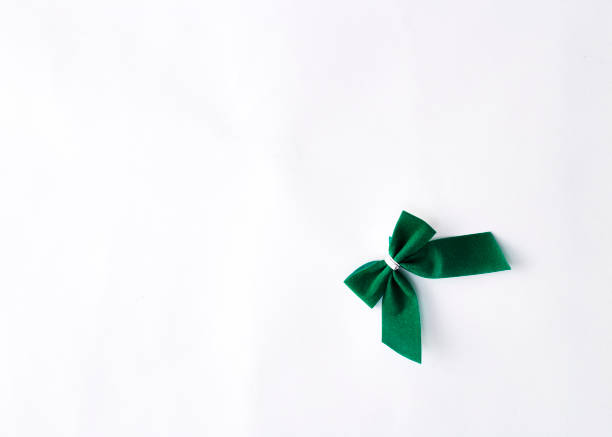 istock single green velvet bow isolated on white 932560876
