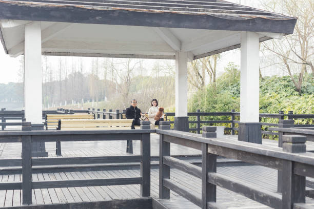 Kharkiv city, Ukraine - October 23, 2024: Concrete pavilion on three supports over a spring water source. Construction of unusual shape and architecture in Sarzhin Yar park
