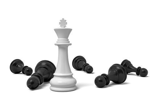 3d rendering of a single standing white chess king piece among many fallen black pawns. Chess figures. Playing to win. Board games.
