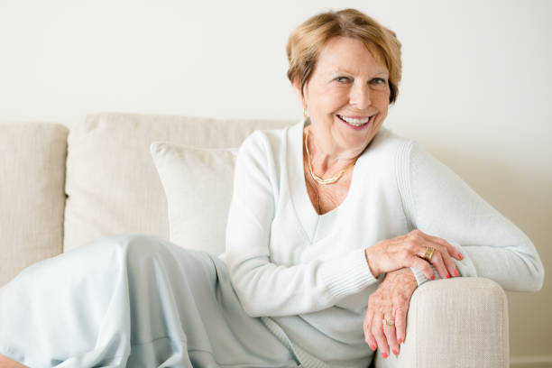 istock Happy Senior Woman in sofa 932577182