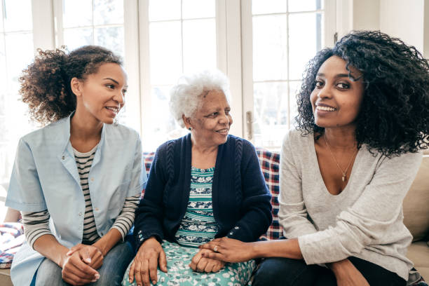 istock Nurse visiting senior lady at home 932585998