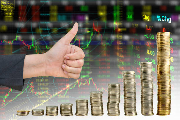 istock Hand showing good in graph  from coin mix stock exchange graph background 932586258