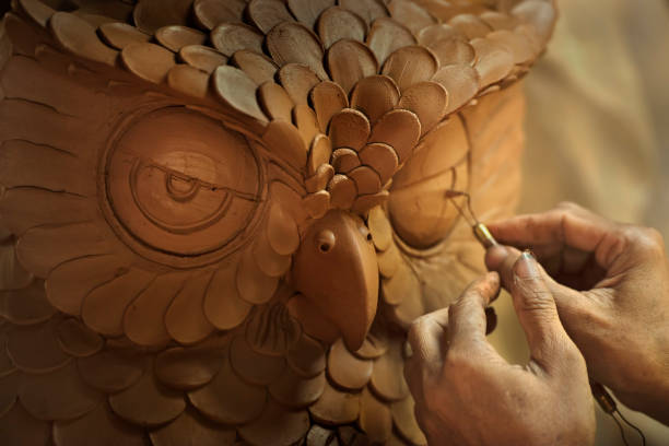 owl made by browm clay - sculpture clay human face human head imagens e fotografias de stock