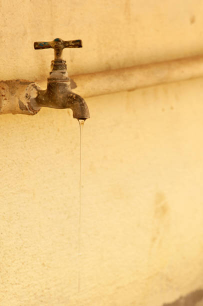 istock old rusty tap leaking water in the old room 932589924