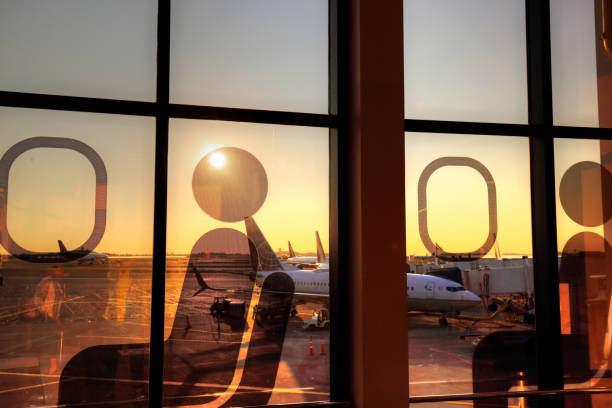 istock Airport terminal at sunset 932593252
