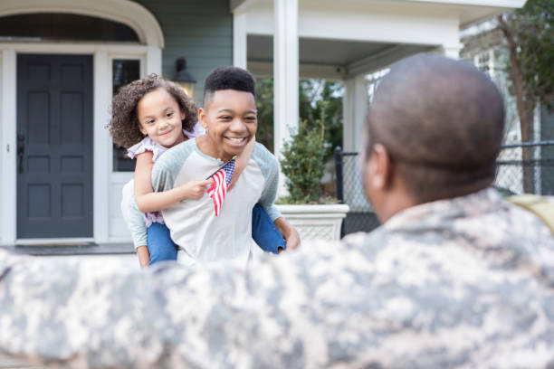 istock Army dad is excited to see his children 932608616