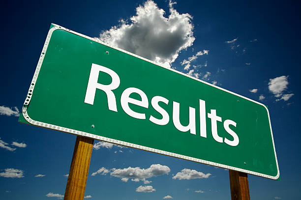 istock Green road sign stating results with a cloudy background 93260866