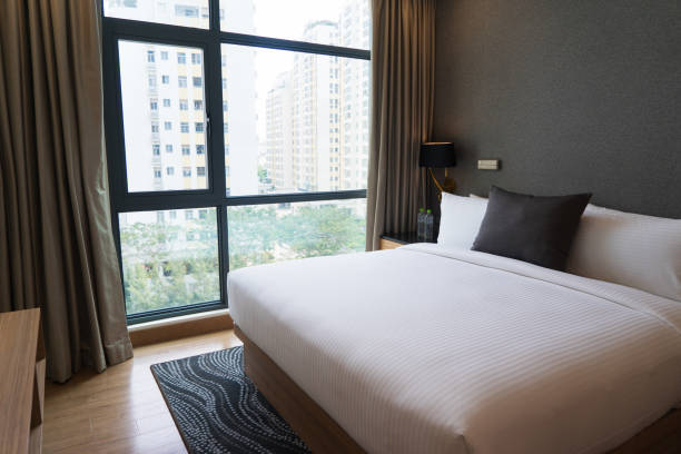 istock King size bed in hotel room 932613178