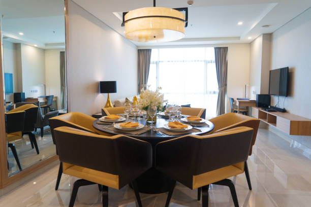 istock Modern dining room with flower arrangement 932613180