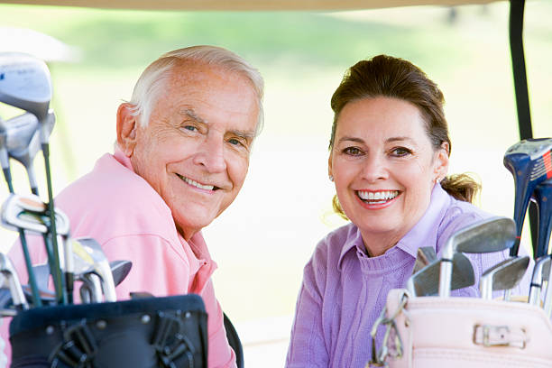 istock Couple Enjoying A Game Of Golf 93262149