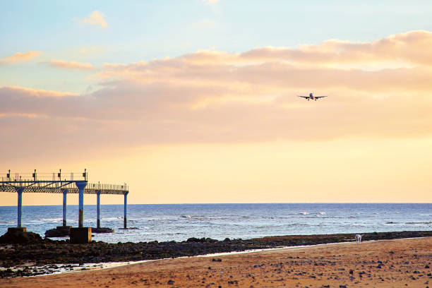 istock Beautiful Lanzarote island landscape with airplain at sunset 932623990