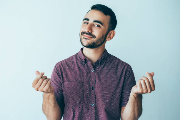 istock Content Man Rubbing Fingers and Asking for Money 932624368