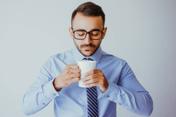 istock Serious Business Man Enjoying Drinking Tea 932624526