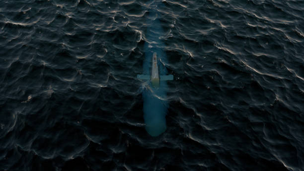 3d illustration of a submarine patrolling just below the water's surface - submarino subaquático imagens e fotografias de stock