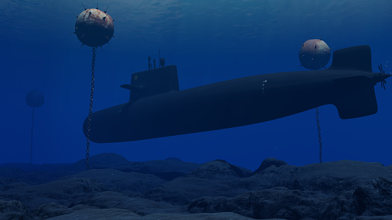 A World War II era U-Boat submarine navigating the depths of an ocean, passing perilously close to an old-fashioned contact sea mine.
