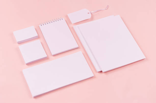 istock White branding stationery, mock up scene on light soft pastel pink background, blank objects for placing your design. 932632984
