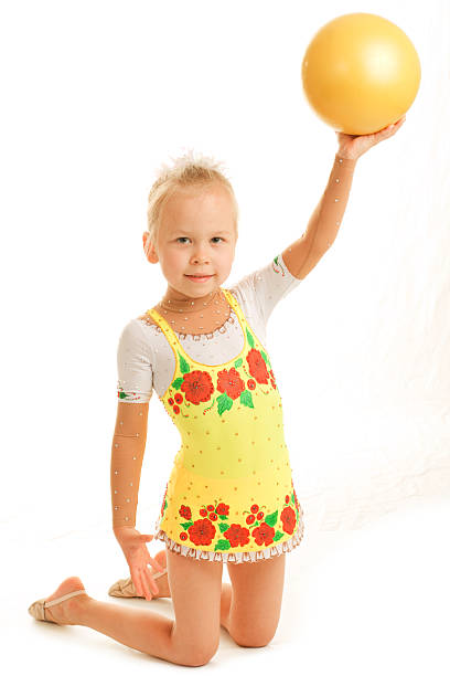 istock Little child gymnast with ball 93263457