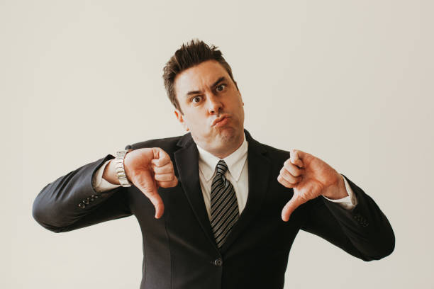 istock Displeased businessman showing thumbs down 932635752