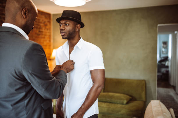 istock gay couple preparing to night out 932636974