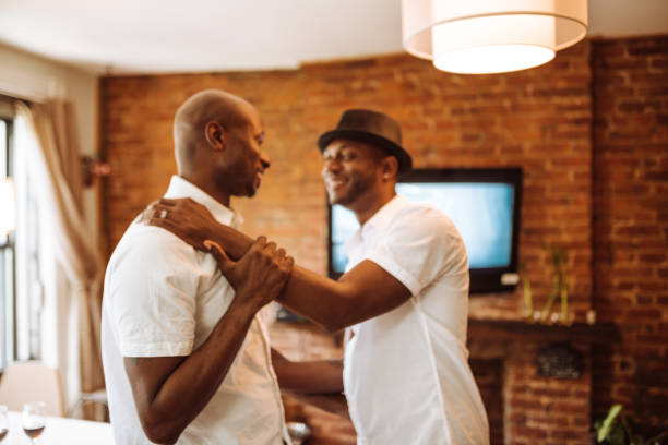 istock gay couple preparing to night out 932637074