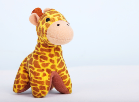 yellow giraffe over white background. Toy object