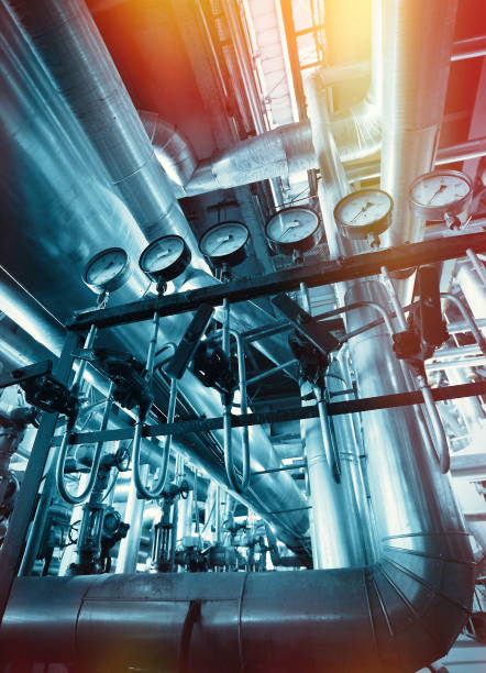 istock Industrial Steel pipelines, valves, cables and walkways 932642016