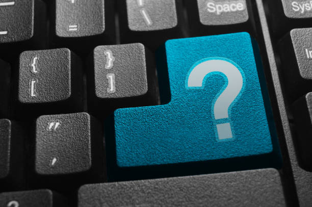 istock Close up view on conceptual keyboard - Question mark key 932646312