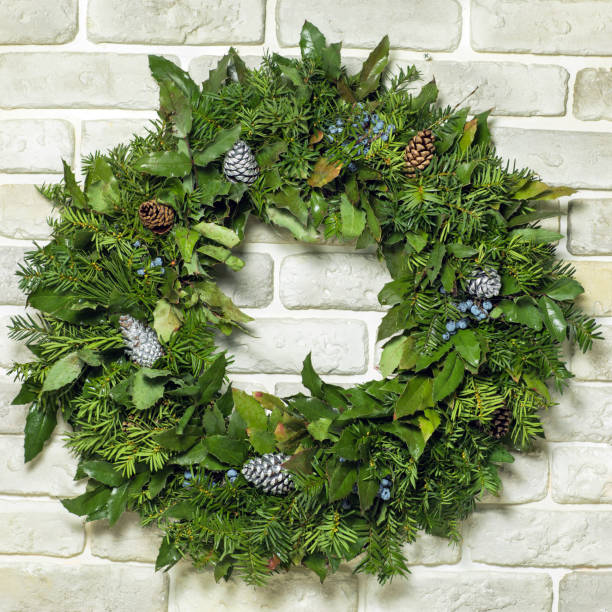 istock a beautiful flower wreath isolated on a bricks background 932646800