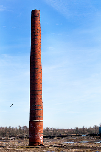 Old  industrial brick chimney in Puttershoek in the Netherlands