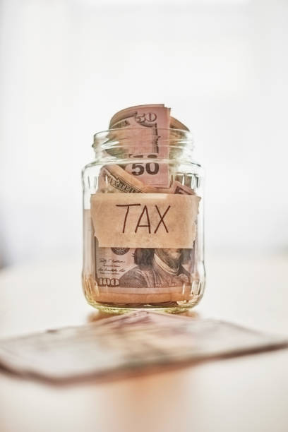 istock Jar with money for tax payment 932651414
