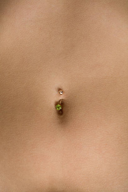istock Female tummy with a navel and piercing 93265295