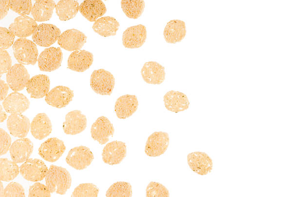 istock Crunchy pieces dry white bread as decorative border isolated on white background, top view. Fast food backdrop. 932658676