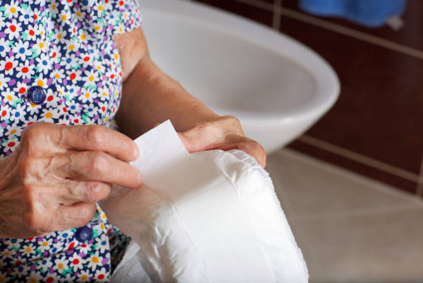 istock Senior woman keeps incontinence liners in her hands 932661788