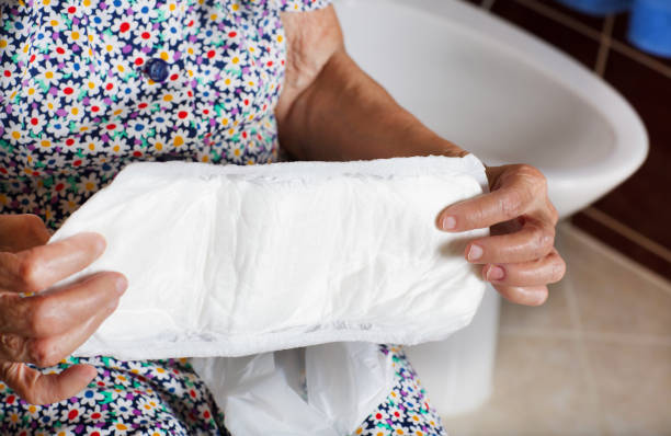 istock Senior woman keeps incontinence liners in her hands 932662822