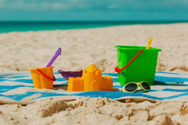 istock kid toys on tropical sand beach 932663978