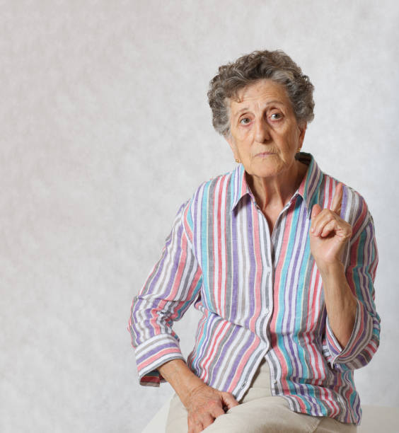 istock Old woman wants to draw someones attention 932664182
