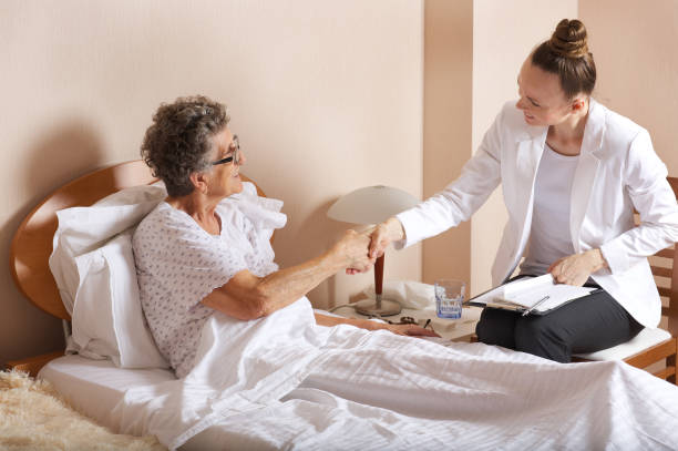 istock Old woman with senior social work assistant. 932670260