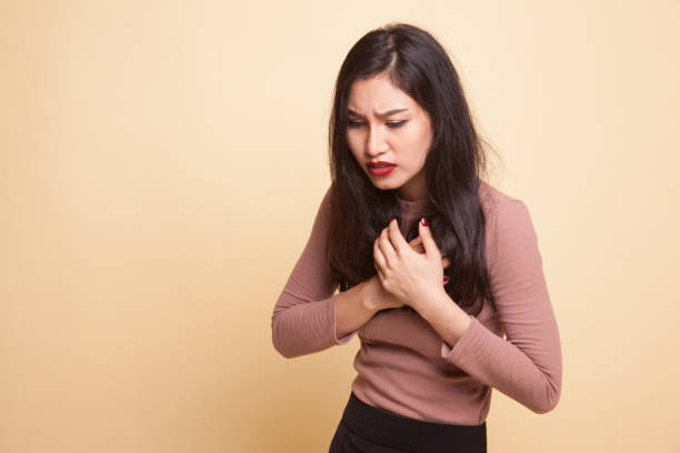 istock Young Asian woman got chest pain. 932673768