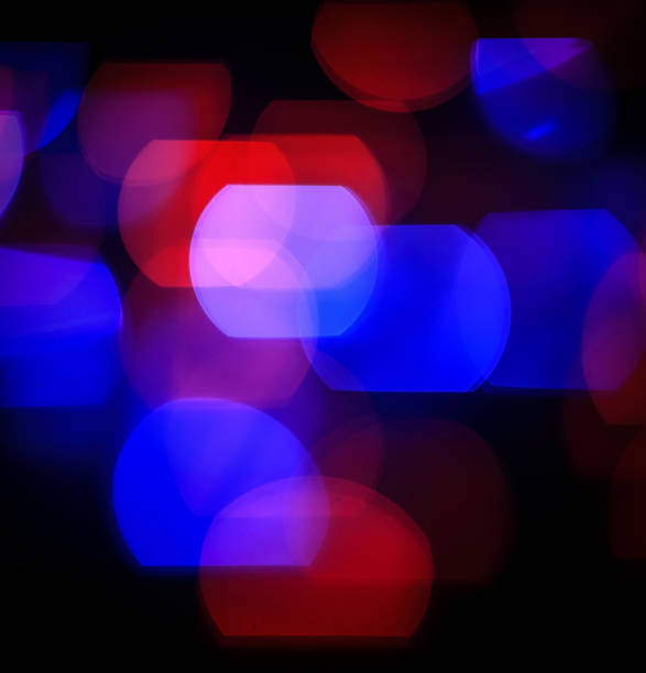 istock festive background.blurred colored lights on a black background 932674506