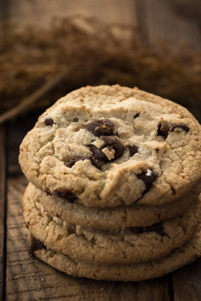 istock Chocolate chip cookies on old wooden table 932680484