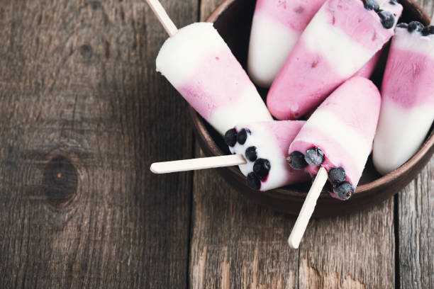 istock Ice pops with berry and Greek yoghurt 932680526