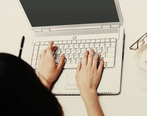 istock The female hands print on the keyboard the computer 932682718