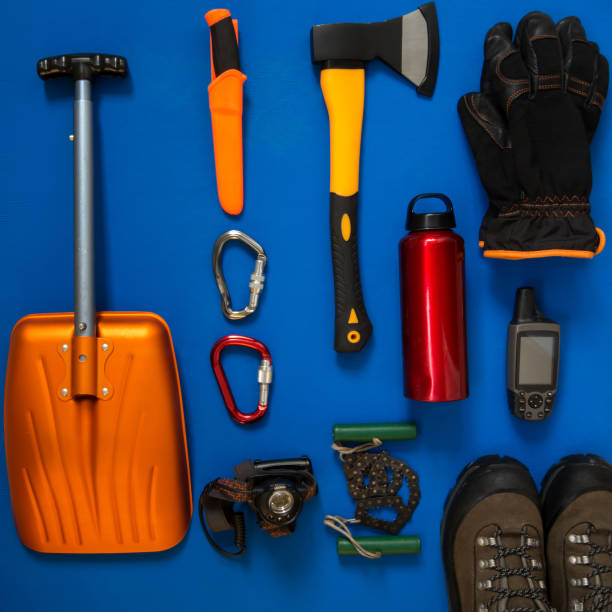 istock Kit of gear for survival on a blue background 932682928