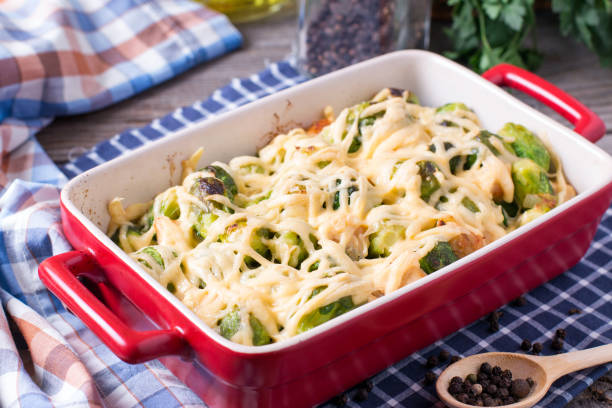 istock Brussels sprouts baked in sauce with cheese in a ceramic form 932683600